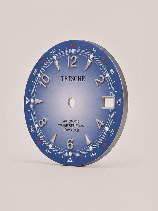 An adventure-inspired dial with a bold, instrument-style design. The combination of applied numerals, directional markings and a detailed outer scale gives the dial the character of a classic navigation instrument, while the contrasting red accents add a distinctive touch.
A perfect choice for a rugged, explorer-inspired watch build with plenty of personality.
Sky Blue
* 28.5 mm diameter
* Applied Arabic numeral hour markers
* Detailed compass-inspired outer scale
* Date window at 3 o’clock
* Contrast