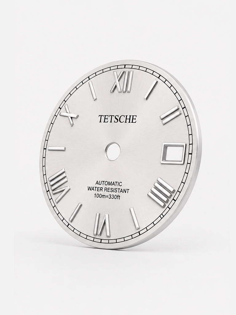 A refined dial inspired by classical Roman design. The applied Roman numerals create an elegant and distinctive character, while the clean black surface and silver-tone details give the dial a timeless, sophisticated appearance.
A perfect choice for a classic watch build with a more formal and elegant expression.
Details
White Silver
28.5 mm diameter
Applied Roman numeral hour markers
Date window at 3 o’clock
Silver-tone details
Designed for automatic watch builds