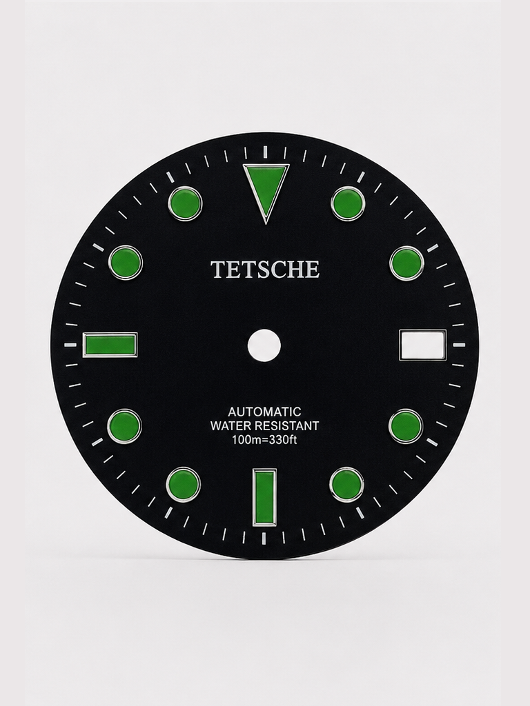 A classic Black with green index dive-inspired dial with a clean, balanced design. The applied hour markers and bold 12 o’clock index provide excellent visual structure, while the subtle sunburst finish adds depth as the light moves across the dial.

Designed to work beautifully in both sporty and more understated builds.

Details

28.5 mm diameter
Applied hour markers
Date window at 3 o’clock
Sunburst finish
Designed for automatic watch builds