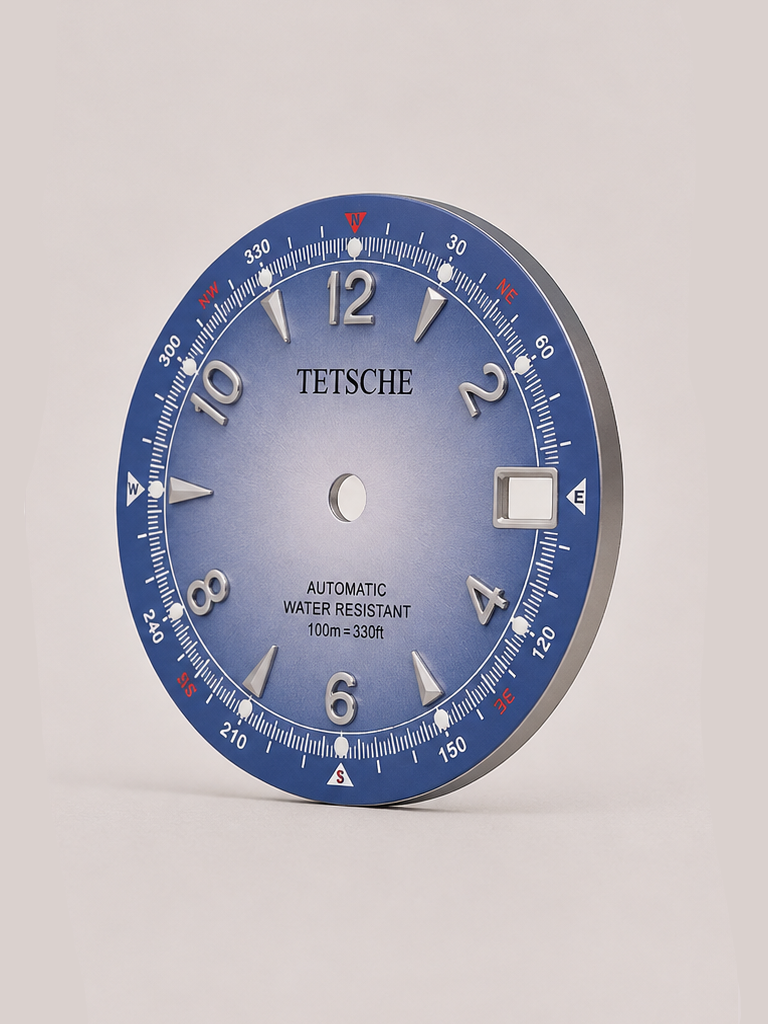 An adventure-inspired dial with a bold, instrument-style design. The combination of applied numerals, directional markings and a detailed outer scale gives the dial the character of a classic navigation instrument, while the contrasting red accents add a distinctive touch.

A perfect choice for a rugged, explorer-inspired watch build with plenty of personality.

Sky Blue
* 28.5 mm diameter
* Applied Arabic numeral hour markers
* Detailed compass-inspired outer scale
* Date window at 3 o’clock
* Contrast