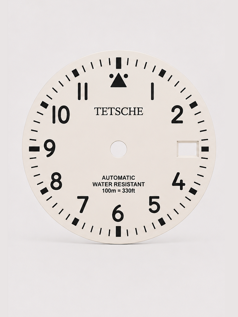 A clean field-inspired dial designed around maximum legibility and simplicity. The bold Arabic numerals, high-contrast minute track and distinctive 12 o’clock marker give the dial a functional, utilitarian character reminiscent of classic expedition and field watches.

A great choice for a rugged everyday build with a clean, understated look.

White
* 28.5 mm diameter
* Arabic numeral hour markers
* High-contrast minute track
* Date window at 3 o’clock
* Distinctive 12 o’clock marker
* Designed for a