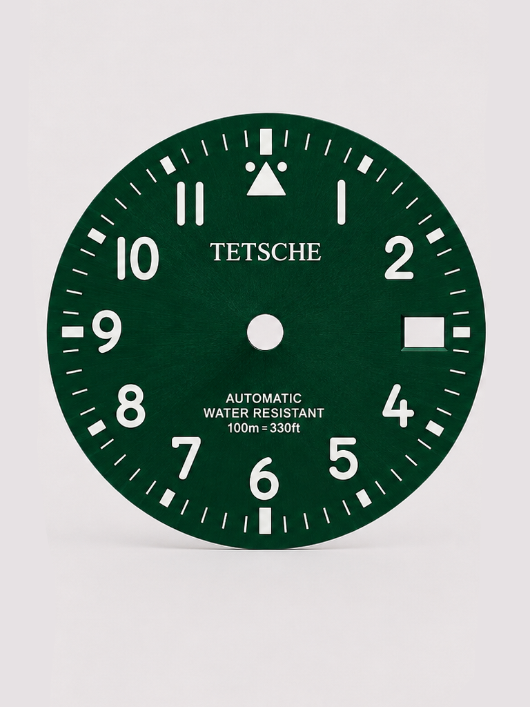 A clean field-inspired dial designed around maximum legibility and simplicity. The bold Arabic numerals, high-contrast minute track and distinctive 12 o’clock marker give the dial a functional, utilitarian character reminiscent of classic expedition and field watches.

A great choice for a rugged everyday build with a clean, understated look.

Green
* 28.5 mm diameter
* Arabic numeral hour markers
* High-contrast minute track
* Date window at 3 o’clock
* Distinctive 12 o’clock marker
* Designed for a