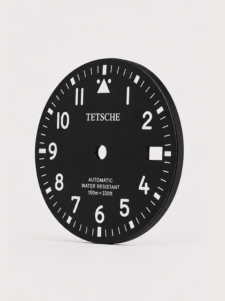 A clean field-inspired dial designed around maximum legibility and simplicity. The bold Arabic numerals, high-contrast minute track and distinctive 12 o’clock marker give the dial a functional, utilitarian character reminiscent of classic expedition and field watches.

A great choice for a rugged everyday build with a clean, understated look.

Black
* 28.5 mm diameter
* Arabic numeral hour markers
* High-contrast minute track
* Date window at 3 o’clock
* Distinctive 12 o’clock marker
* Designed for a