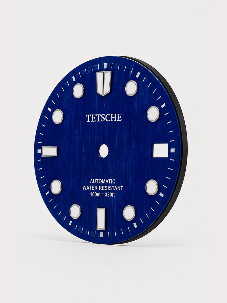 A bold vintage-inspired dial with a distinctive woodgrain-style texture that gives the surface a rich sense of depth and character. The applied hour markers provide a clean contrast against the deep green finish, combining classic dive-watch elements with a more unconventional retro look.

A great choice for a watch build with a natural, distinctive personality.

Blue
28.5 mm diameter
Applied hour markers
Woodgrain-style textured finish
Detailed outer minute track
Date window at 3 o’clock
Designed for a