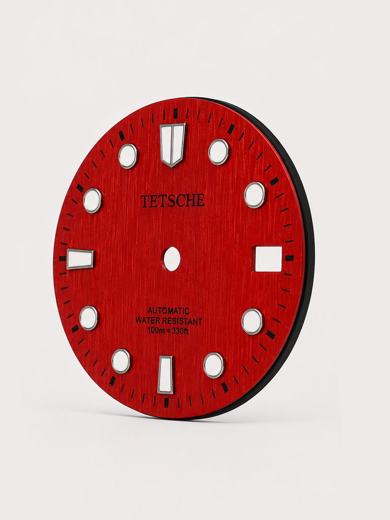 A bold vintage-inspired dial with a distinctive woodgrain-style texture that gives the surface a rich sense of depth and character. The applied hour markers provide a clean contrast against the deep green finish, combining classic dive-watch elements with a more unconventional retro look.

A great choice for a watch build with a natural, distinctive personality.

Red
28.5 mm diameter
Applied hour markers
Woodgrain-style textured finish
Detailed outer minute track
Date window at 3 o’clock
Designed for a