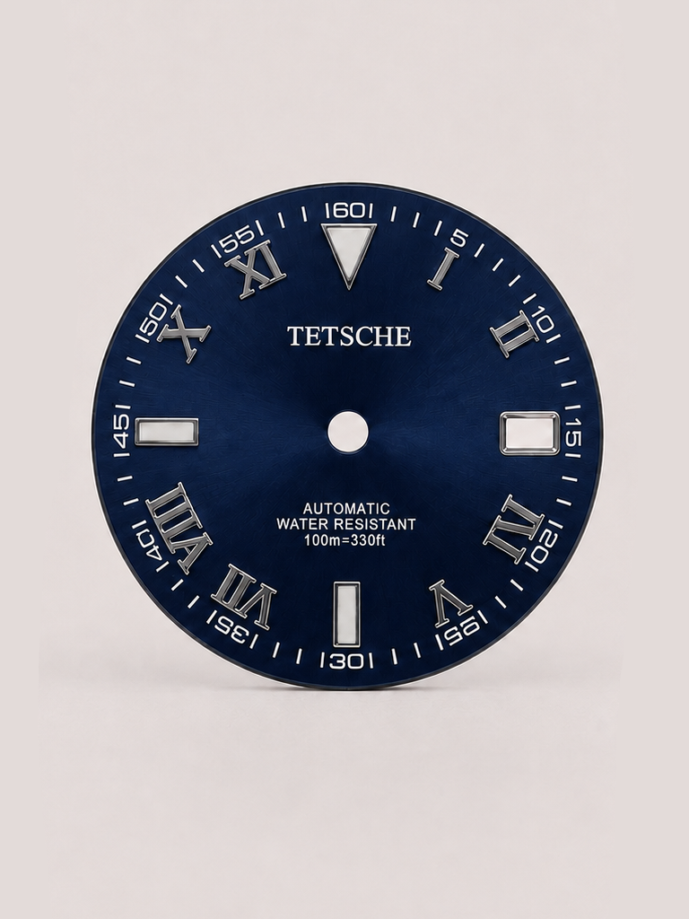 A distinctive dial that combines classical Roman numerals with a more technical, contemporary layout. The outer minute markings add depth and character, while the applied silver-tone details stand out against the dark dial for a bold yet refined appearance.

A great choice for a classic watch build that blends traditional design with a modern edge.

DarkBlue
28.5 mm diameter
Applied Roman numeral hour markers
Detailed outer minute track
Date window at 3 o’clock
Silver-tone details
Designed for automatic wat