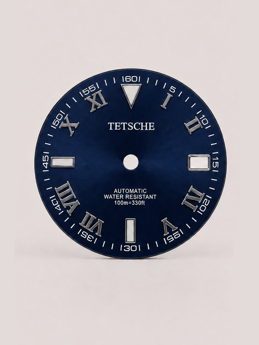 A distinctive dial that combines classical Roman numerals with a more technical, contemporary layout. The outer minute markings add depth and character, while the applied silver-tone details stand out against the dark dial for a bold yet refined appearance.

A great choice for a classic watch build that blends traditional design with a modern edge.

DarkBlue
28.5 mm diameter
Applied Roman numeral hour markers
Detailed outer minute track
Date window at 3 o’clock
Silver-tone details
Designed for automatic wat