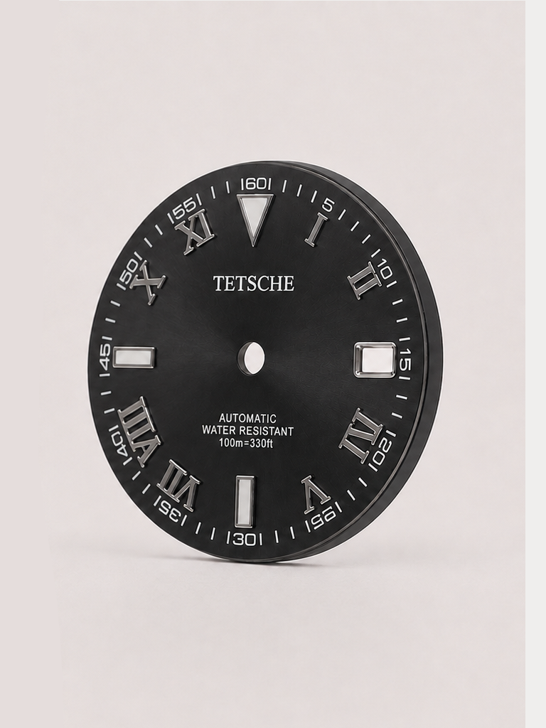 A distinctive dial that combines classical Roman numerals with a more technical, contemporary layout. The outer minute markings add depth and character, while the applied silver-tone details stand out against the dark dial for a bold yet refined appearance.

A great choice for a classic watch build that blends traditional design with a modern edge.

DarkGray
28.5 mm diameter
Applied Roman numeral hour markers
Detailed outer minute track
Date window at 3 o’clock
Silver-tone details
Designed for automatic wat